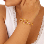 elegant gold plated triangle bracelet with pink stone accents