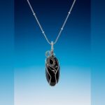 elegant black stone pendant with silver wire design